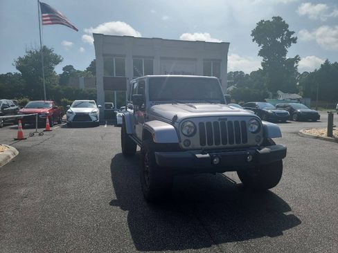 Used 2015 Jeep Wrangler Unlimited Sahara AWD/4WD image 1