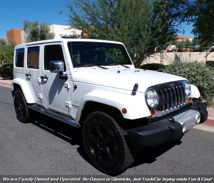 Used 2012 Jeep Wrangler Unlimited Sahara w/ Dual Top Group AWD/4WD image 1