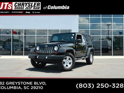 Used 2012 Jeep Wrangler Unlimited Sport AWD/4WD image 1