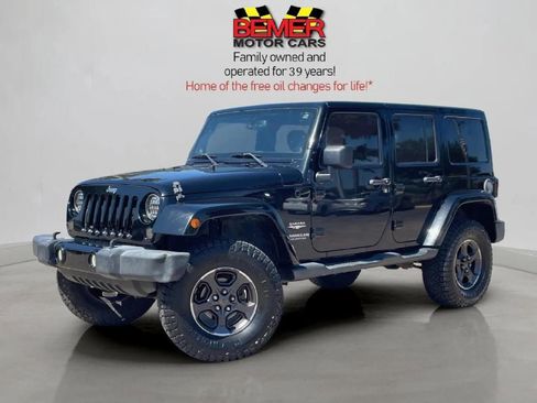 Used 2014 Jeep Wrangler Unlimited Sahara w/ Max Tow Package image 1