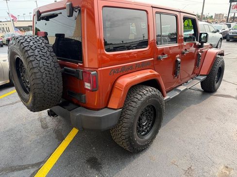 Used 2014 Jeep Wrangler Unlimited Sahara w/ Dual Top Group AWD/4WD image 7