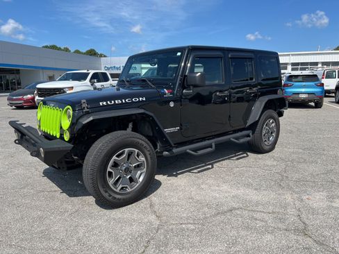 Used 2013 Jeep Wrangler Unlimited Rubicon w/ Dual Top Group AWD/4WD image 1