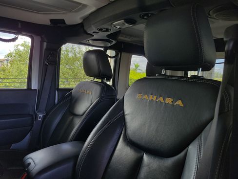 Used 2014 Jeep Wrangler Unlimited Sahara w/ Dual Top Group AWD/4WD image 16