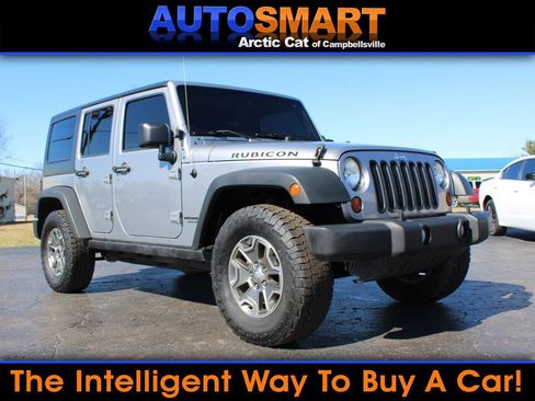 Used 2013 Jeep Wrangler Unlimited Rubicon w/ Dual Top Group image 1
