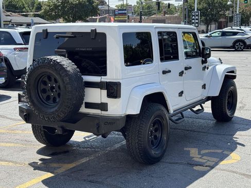 Used 2012 Jeep Wrangler Unlimited Sahara w/ Dual Top Group AWD/4WD image 10