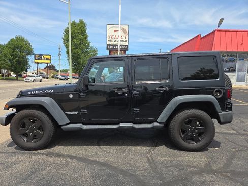 Used 2012 Jeep Wrangler Unlimited Rubicon w/ Dual Top Group AWD/4WD image 1
