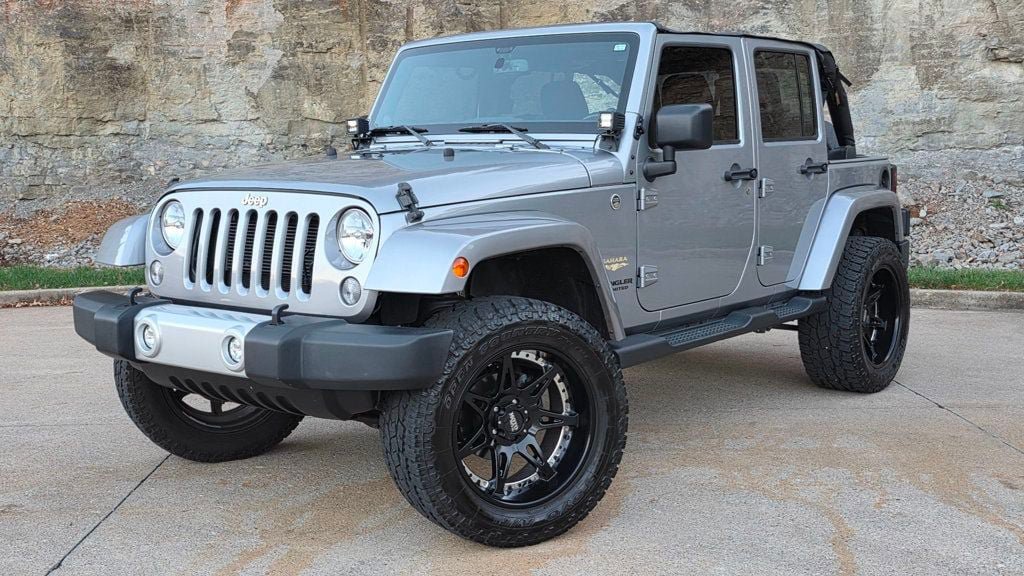 Used 2014 Jeep Wrangler Unlimited Sahara AWD/4WD image 1