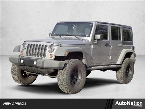 Used 2013 Jeep Wrangler Unlimited Sport w/ Mopar Black Appearance Group AWD/4WD image 1
