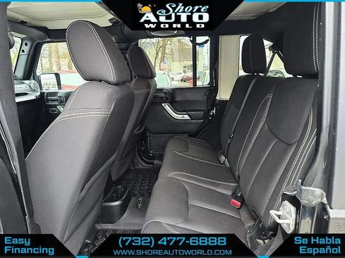 Used 2014 Jeep Wrangler Unlimited Sahara w/ Dual Top Group AWD/4WD image 17