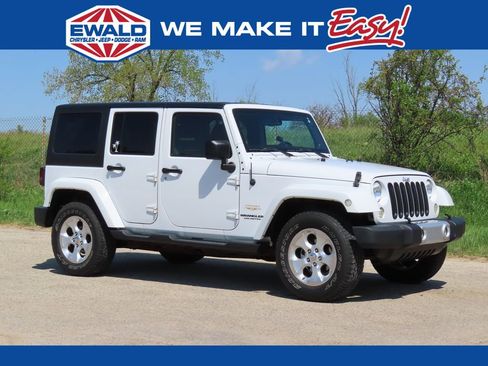 Used 2013 Jeep Wrangler Unlimited Sahara w/ Dual Top Group AWD/4WD image 1