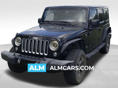 Used 2016 Jeep Wrangler Unlimited Sahara AWD/4WD image 1