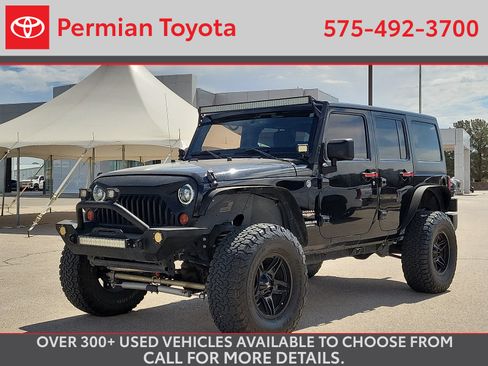 Used 2013 Jeep Wrangler Unlimited Sahara w/ Trailer Tow Group AWD/4WD image 1