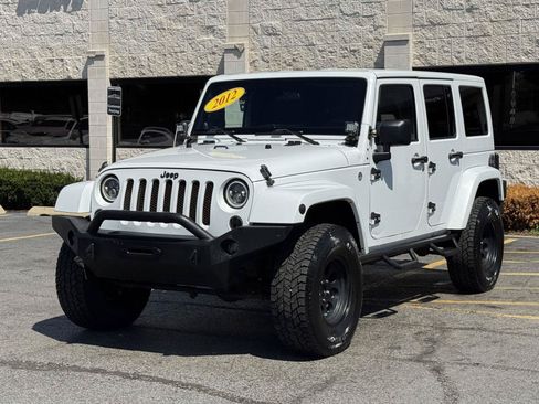 Used 2012 Jeep Wrangler Unlimited Sahara w/ Dual Top Group AWD/4WD image 16