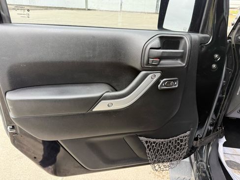 Used 2013 Jeep Wrangler Unlimited Sahara w/ Dual Top Group AWD/4WD image 16