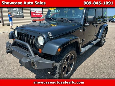 Used 2012 Jeep Wrangler Unlimited Sahara AWD/4WD image 1