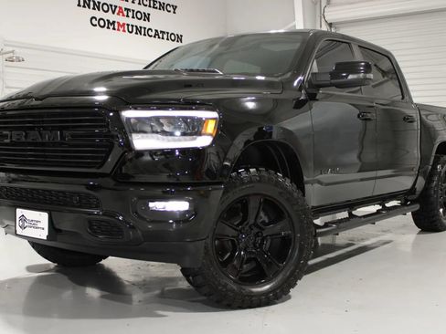 Used 2024 RAM 1500 Laramie AWD/4WD image 1