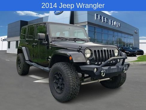 Used 2014 Jeep Wrangler Unlimited Sahara w/ Dual Top Group AWD/4WD image 1