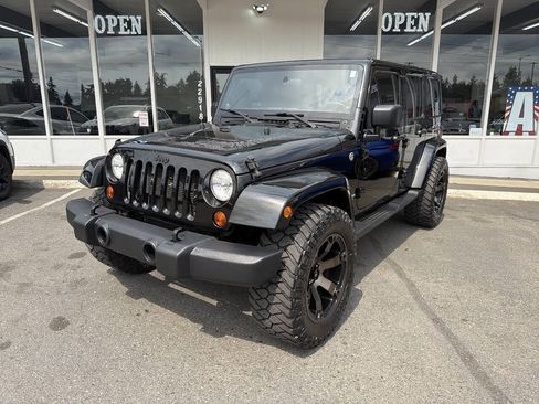 Used 2012 Jeep Wrangler Unlimited Sahara AWD/4WD image 1