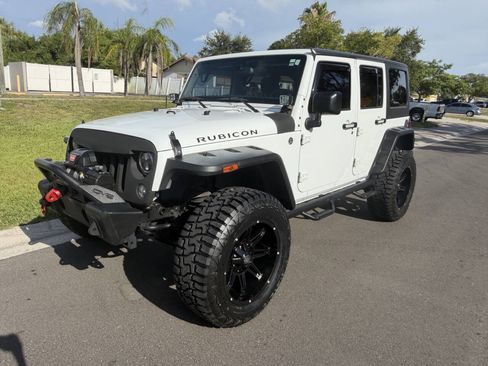 Used 2014 Jeep Wrangler Unlimited Rubicon w/ Dual Top Group AWD/4WD image 1