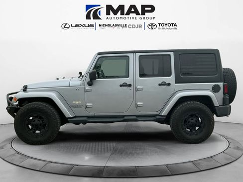 Used 2015 Jeep Wrangler Unlimited Sahara w/ Dual Top Group AWD/4WD image 2