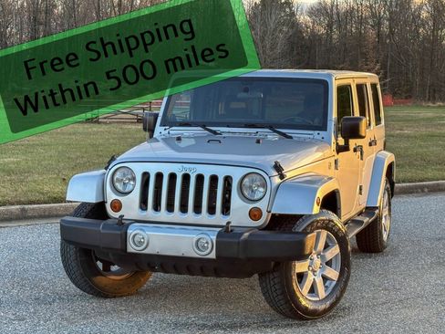 Used 2012 Jeep Wrangler Unlimited Sahara w/ Dual Top Group image 1
