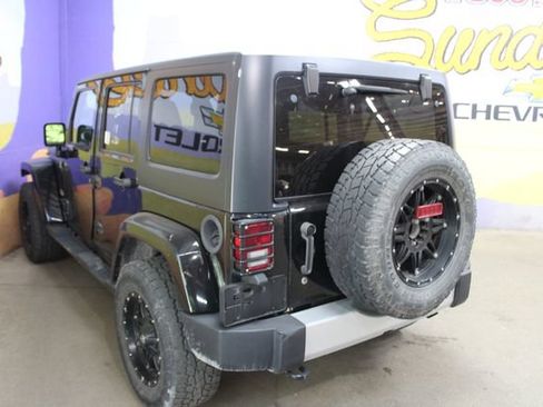 Used 2014 Jeep Wrangler Unlimited Sahara w/ Dual Top Group AWD/4WD image 6
