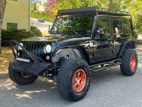 Used 2015 Jeep Wrangler Unlimited Sahara AWD/4WD image 1