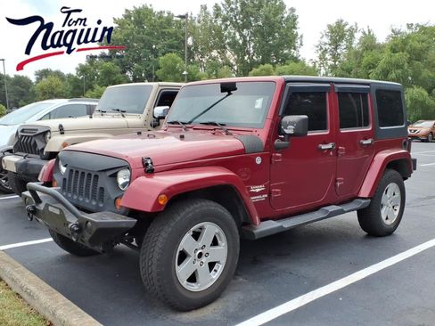 Used 2012 Jeep Wrangler Unlimited Sahara w/ Dual Top Group AWD/4WD image 1