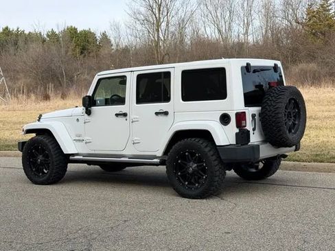 Used 2013 Jeep Wrangler Unlimited Sahara w/ Dual Top Group AWD/4WD image 16
