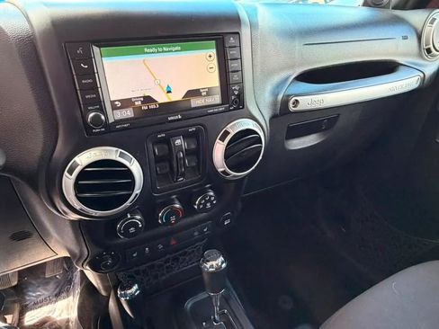 Used 2014 Jeep Wrangler Unlimited Sahara w/ Dual Top Group AWD/4WD image 11