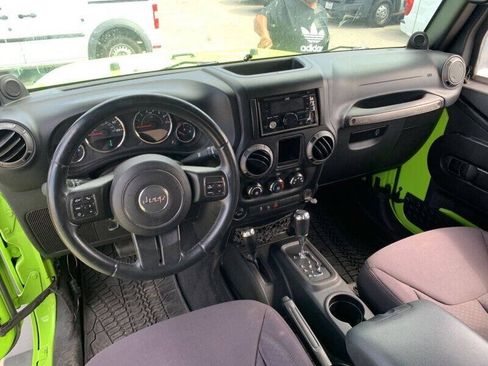 Used 2013 Jeep Wrangler Unlimited Sport w/ Mopar Black Appearance Group AWD/4WD image 17