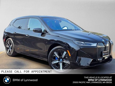 Used 2024 BMW iX xDrive50 w/ Premium Package AWD/4WD image 1