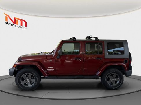 Used 2010 Jeep Wrangler Unlimited Sahara w/ Dual Top Group AWD/4WD image 2