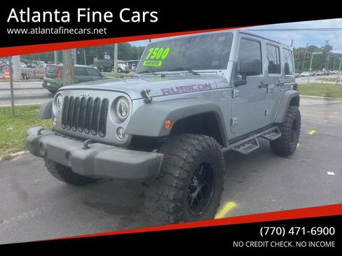 Used 2014 Jeep Wrangler Unlimited Rubicon w/ Dual Top Group AWD/4WD image 1