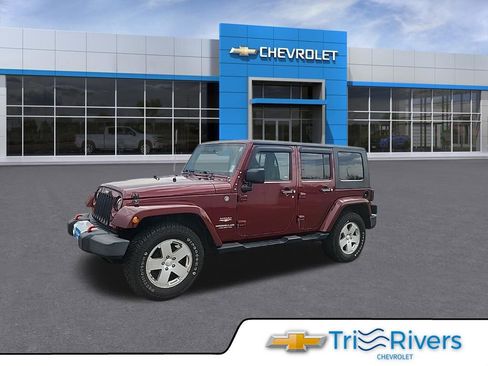 Used 2010 Jeep Wrangler Unlimited Sahara w/ Dual Top Group image 1