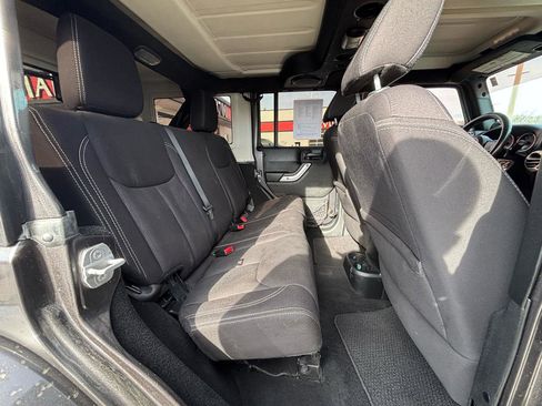 Used 2014 Jeep Wrangler Unlimited Sahara w/ Dual Top Group AWD/4WD image 12