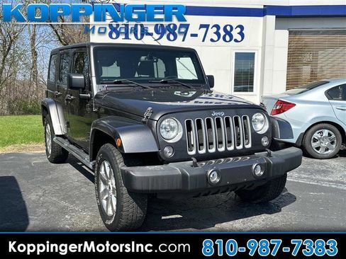 Used 2016 Jeep Wrangler Unlimited Sahara w/ Dual Top Group AWD/4WD image 1