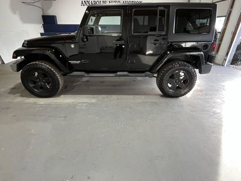 Used 2012 Jeep Wrangler Unlimited Sahara w/ Dual Top Group image 1