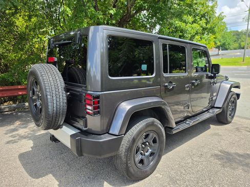 Used 2014 Jeep Wrangler Unlimited Sahara w/ Dual Top Group AWD/4WD image 6