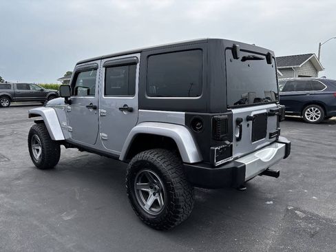 Used 2014 Jeep Wrangler Unlimited Sahara w/ Dual Top Group AWD/4WD image 8