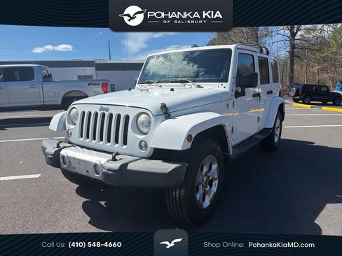 Used 2014 Jeep Wrangler Unlimited Sahara w/ Dual Top Group image 1
