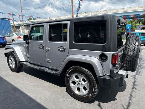 Used 2014 Jeep Wrangler Unlimited Sahara w/ Dual Top Group AWD/4WD image 6