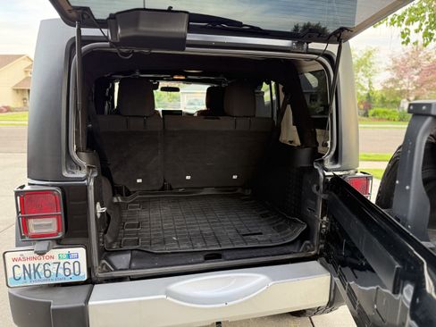 Used 2012 Jeep Wrangler Unlimited Sport w/ Black Appearance Group AWD/4WD image 1