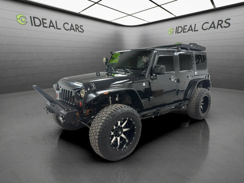 Used 2013 Jeep Wrangler Unlimited Sport AWD/4WD image 1