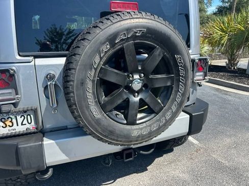 Used 2013 Jeep Wrangler Unlimited Sahara w/ Dual Top Group AWD/4WD image 11