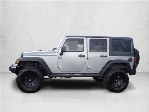 Used 2013 Jeep Wrangler Unlimited Sport w/ Mopar Black Appearance Group AWD/4WD image 2