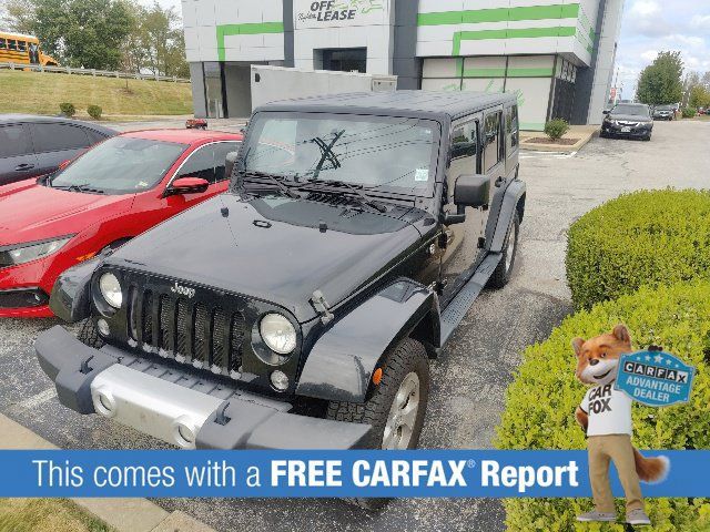 Used 2014 Jeep Wrangler Unlimited Sahara w/ Dual Top Group AWD/4WD image 2
