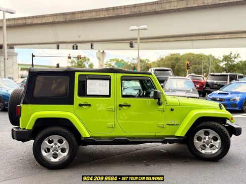 Used 2013 Jeep Wrangler Unlimited Sahara w/ Dual Top Group AWD/4WD image 9