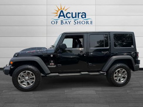 Used 2013 Jeep Wrangler Unlimited Rubicon w/ Dual Top Group AWD/4WD image 2