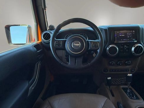 Used 2013 Jeep Wrangler Unlimited Sahara w/ Dual Top Group AWD/4WD image 16